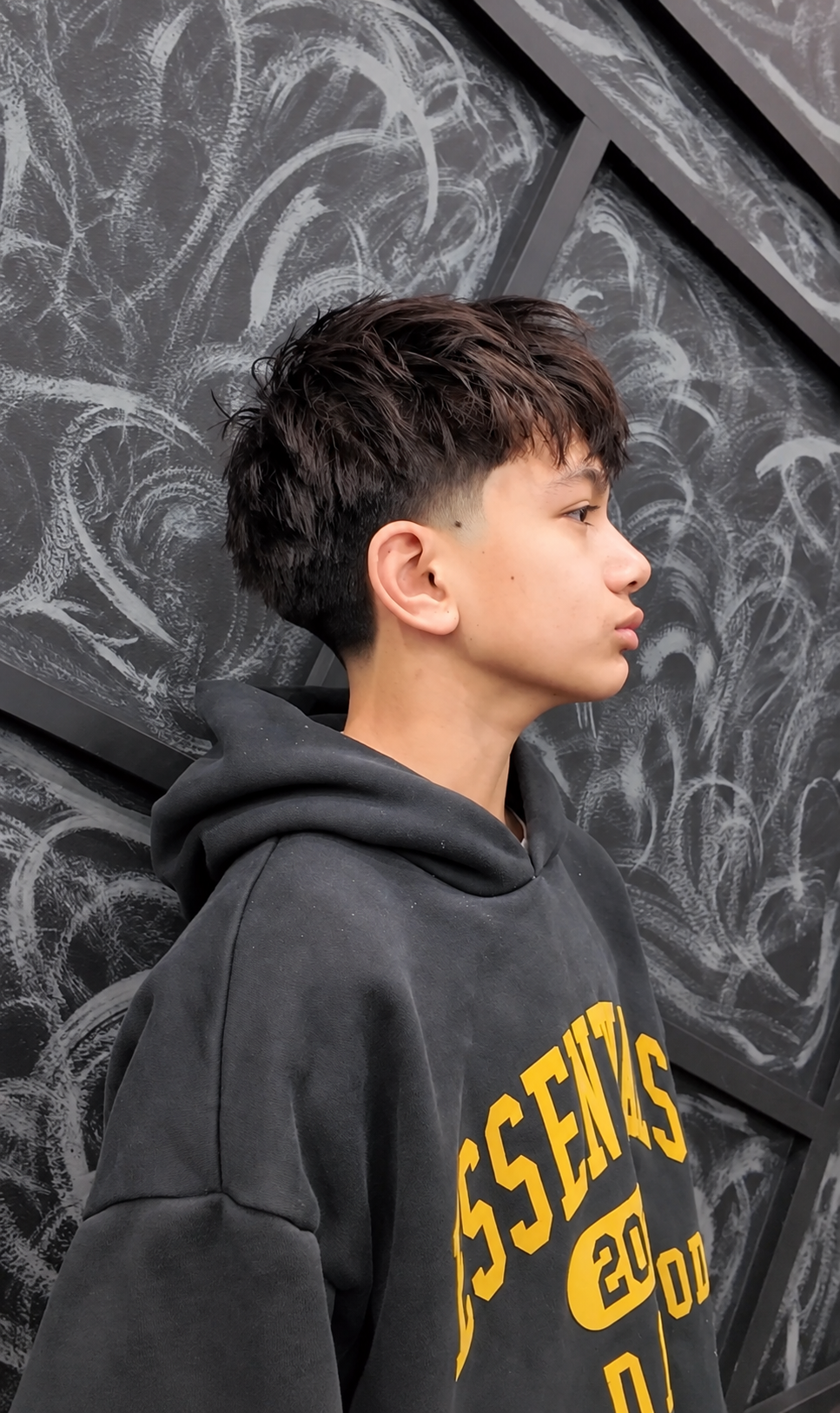 Textured haircut with clean sides by Rumi Fades